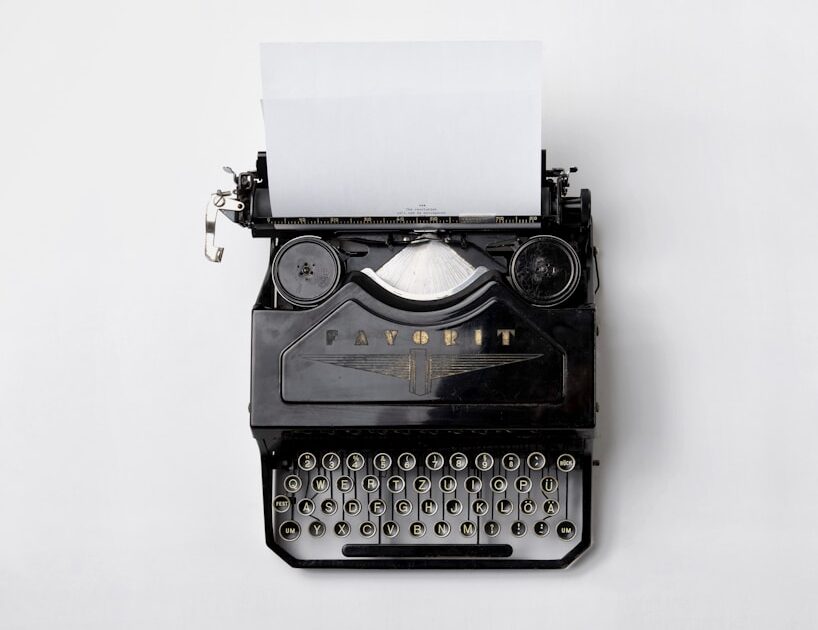 black Fayorit typewriter with printer paper